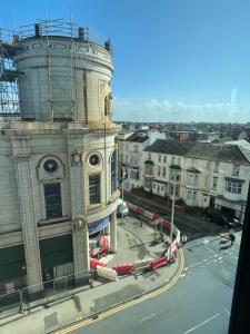 a building with a clock tower on top of it at Backpackers Blackpool - Family Friendly Hotel in Blackpool