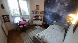 a bedroom with a bed with two teddy bears on it at Comfy Appartement 85m2 in a calm area in Montreuil 10min from Paris in Montreuil