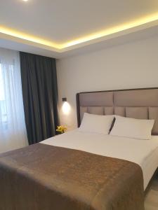 Een bed of bedden in een kamer bij Hotel Kriti