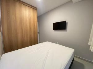 Cama o camas de una habitación en Apê aconchegante praia