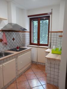 a kitchen with a sink and a window at La Dolce Vita in Naples