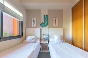 Posteľ alebo postele v izbe v ubytovaní Sailor House con piscina en la nueva Milla de Oro