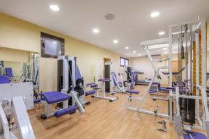 a gym with a bunch of treadmills and machines at Crisol Regio in Santa Marta de Tormes