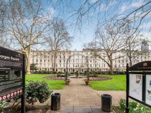 a large building in front of a park at Chic cosy Flat in Central London Pass the Keys in London