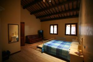 A bed or beds in a room at B&B Contarine