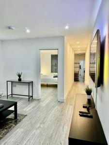 a living room with a table and a bed at Rooms Near Me - Apartment 1, Sky Tv, Free Parking 