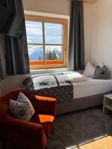 Katil atau katil-katil dalam bilik di GLOCKNERALM - HIKING- and SKIHOTEL exklusively accessible by cable car