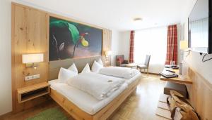 Postel nebo postele na pokoji v ubytování Hotel Sonnentau