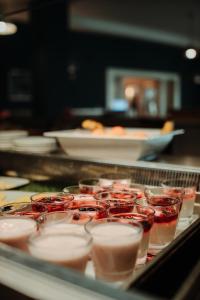 a bunch of cups of food on a tray at Celtic Ross Hotel & Leisure Centre in Rosscarbery