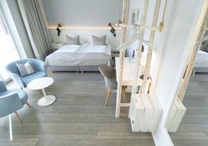Postel nebo postele na pokoji v ubytování Hotel Am Medemufer