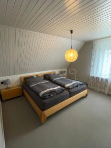 a bedroom with a large bed in a room at Ferienhaus Heideglück in Bad Fallingbostel
