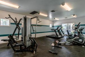 a gym with three exercise bikes in a room at Sunshine Cottage 31C By Pkrm in Pensacola