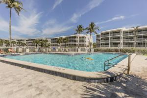a large swimming pool in front of a building at SOUTH SEAS BEACH VILLA 2428 in Captiva