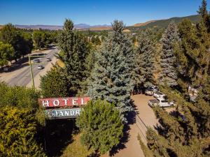 an overhead view of a parking lot with trees and a sign at Alejandro in Junín de los Andes