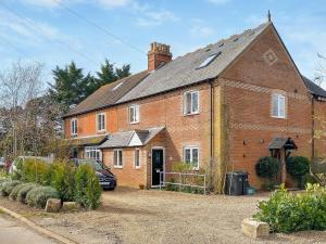 a large brick house with a car parked in front of it at Harbour Hill in Chickerell