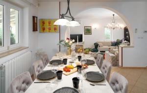 a dining room with a table and chairs at Villa Duga in Poreč