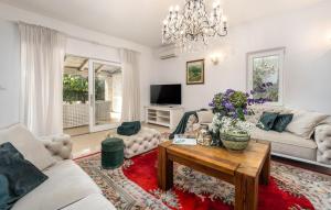 a living room with a couch and a table at Villa Duga in Poreč