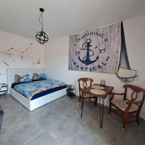 A bed or beds in a room at L'Ancora La Ciaccia