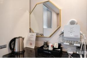 Принадлежности для чая и кофе в Hotel 24st Prestige