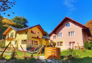 a house with a hammock in front of it at Casa Iulia si Bogdan in Bran
