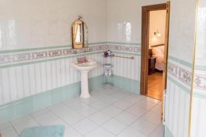 a bathroom with a sink and a mirror at Spacious House in beautiful Malin Head in Keenagh