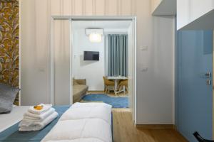 a hotel room with a bed and a living room at Appartamento via Visconti in Rome