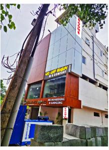 a building with a sign on the side of it at MS Comforts Mahadevapura in Bangalore