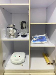 a kitchen pantry with a blender and a blender at apartment in neiva goliat in Neiva