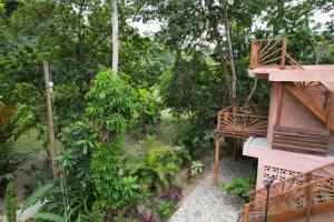 a view of a garden from the balcony of a house at Salvia Madre in Santa Marta