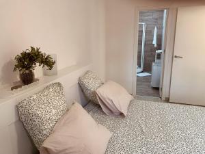 a living room with a couch and a plant at Casa Susanna Apartment Costa del Silencio in Costa Del Silencio