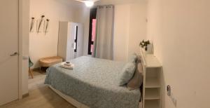 a bedroom with a bed in a white room at Casa Susanna Apartment Costa del Silencio in Costa Del Silencio +27 photos