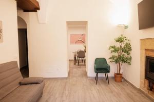 a living room with a couch and a table at Apartamento Cuzco in Trujillo