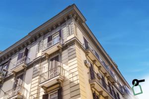 a tall building with balconies on the side of it at Hotiday Room Collection - Napoli Sant'Arcangelo in Naples