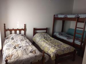 a bedroom with two bunk beds and a bedskirts at Pedro in Balcarce