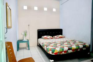 Giường trong phòng chung tại Hotel Kalingga 2