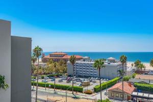a view of a city with a parking lot and the ocean at Santa Monica Two Bedroom Apartment With Amazing Views in Los Angeles