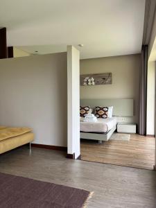 Кровать или кровати в номере Bosque da Harmonia