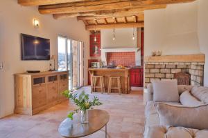 a living room with a couch and a table at Les Demeures de Piana in Piana