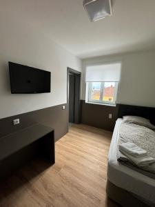 A bed or beds in a room at F Hotel 24h Check-In