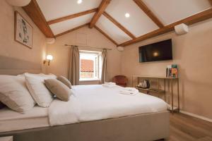 Ein Bett oder Betten in einem Zimmer der Unterkunft Mascheroni Luxury Rooms