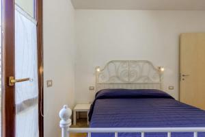 Postel nebo postele na pokoji v ubytování Il Gelsomino casa vacanze a due passi da Numana + 40 fotografií
