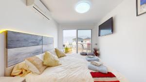 En eller flere senge i et værelse på Gran Alacant bungalow vistas al mar + 48 billeder