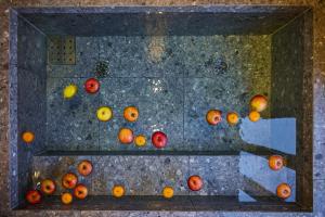 a bunch of fruits sitting on a floor at Hakuba Hibiku Chalet by Jade Group in Hakuba