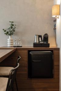 a microwave sitting on top of a wooden counter at Hotel Beach Palace in Blankenberge