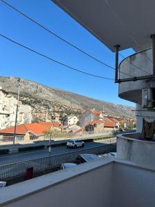 a view of a street with cars on the road at Apartment GeoMo in Mostar