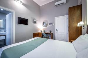 Posteľ alebo postele v izbe v ubytovaní Antico Centro Suite