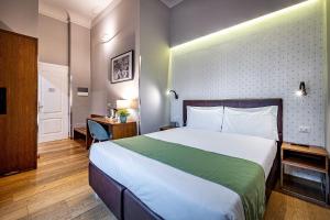 Posteľ alebo postele v izbe v ubytovaní Antico Centro Suite