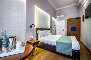 Posteľ alebo postele v izbe v ubytovaní Antico Centro Suite
