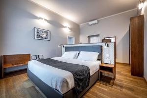 Posteľ alebo postele v izbe v ubytovaní Antico Centro Suite