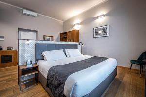 Posteľ alebo postele v izbe v ubytovaní Antico Centro Suite